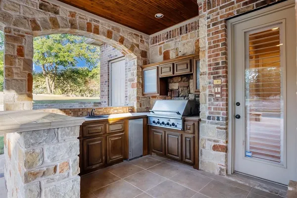 a kitchen that has a sink and a stove