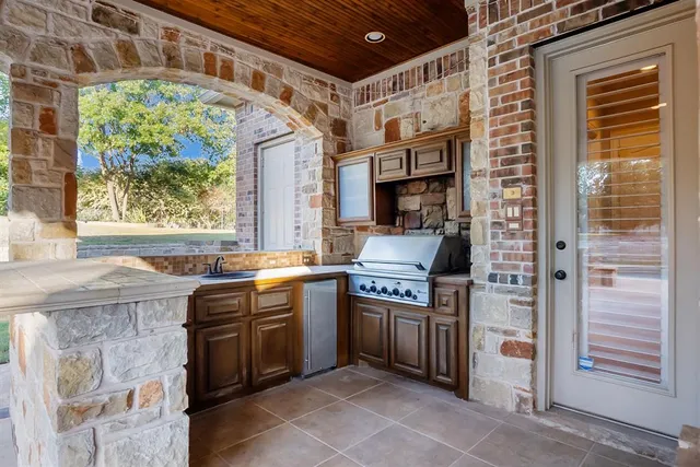 a kitchen that has a sink and a stove