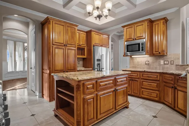 a kitchen with stainless steel appliances granite countertop a stove and a sink