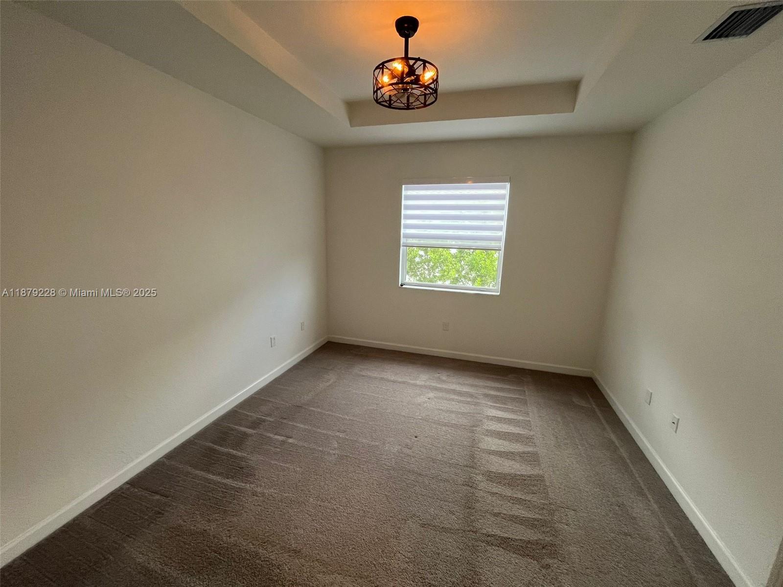2602 Southeast 11th Street, Unit 2602 Homestead, FL 33035 - Photo 11 of 22 an empty room with a window