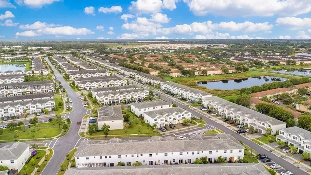 an aerial view of residential building and ocean