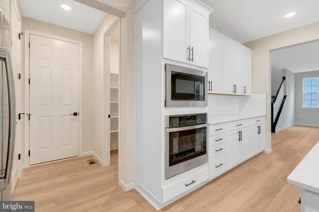 a view of a hallway with windows