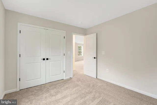 a bathroom with a tub shower and mirror