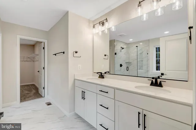 a bathroom with a sink a toilet and a bathtub