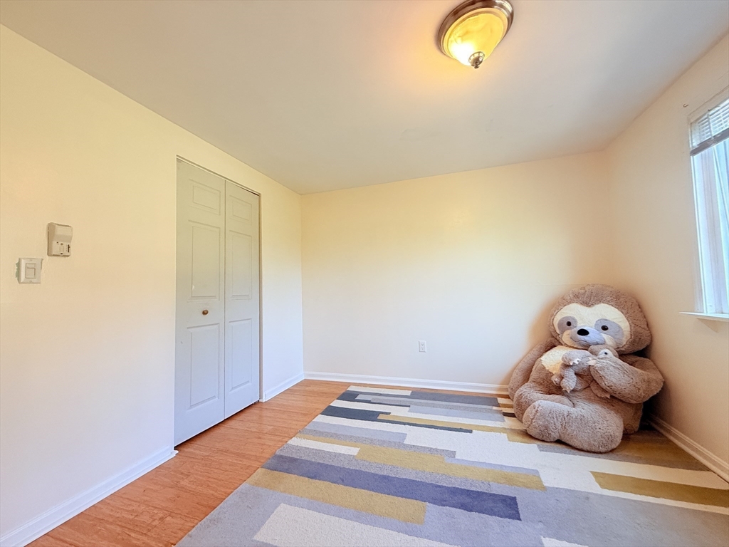 388 Great Road, Unit A1 Acton, MA 01720 - Photo 12 of 18 a bedroom with a bed and a window