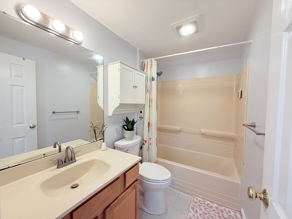 388 Great Road, Unit A1 Acton, MA 01720 - Photo 13 of 18 a bathroom with a sink toilet and shower