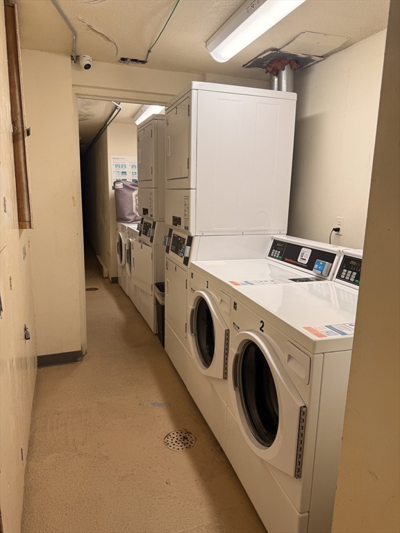 388 Great Road, Unit A1 Acton, MA 01720 - Photo 18 of 18 a utility room with dryer and washer