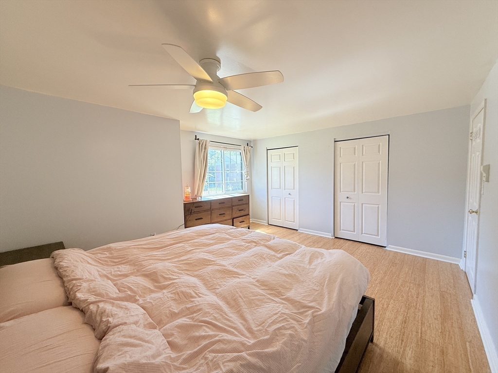 388 Great Road, Unit A1 Acton, MA 01720 - Photo 8 of 18 a bedroom with a bed and a window