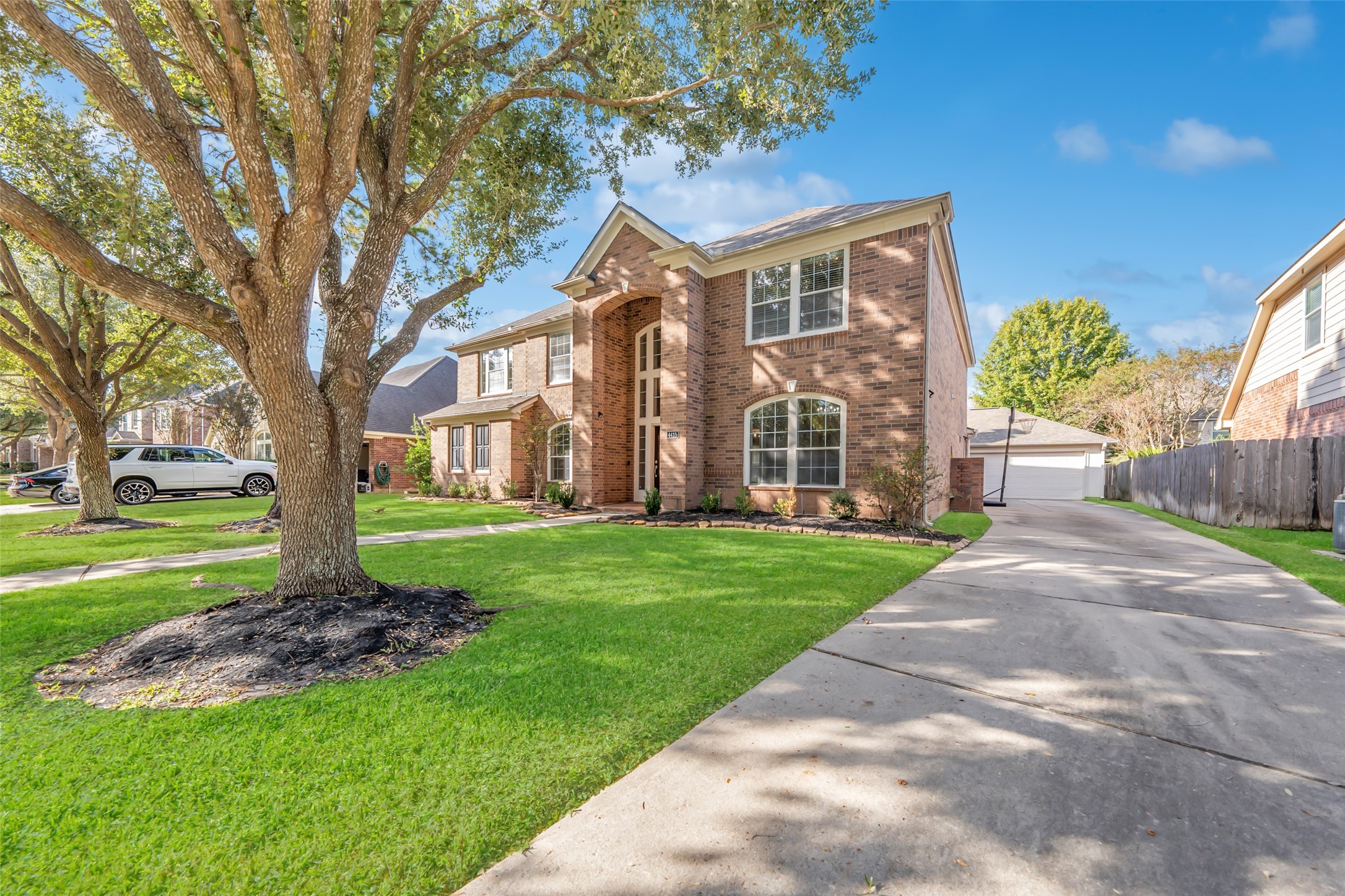 4415 Eden Point Lane Katy, TX 77494 - Photo 1 of 13 a front view of a house with a garden