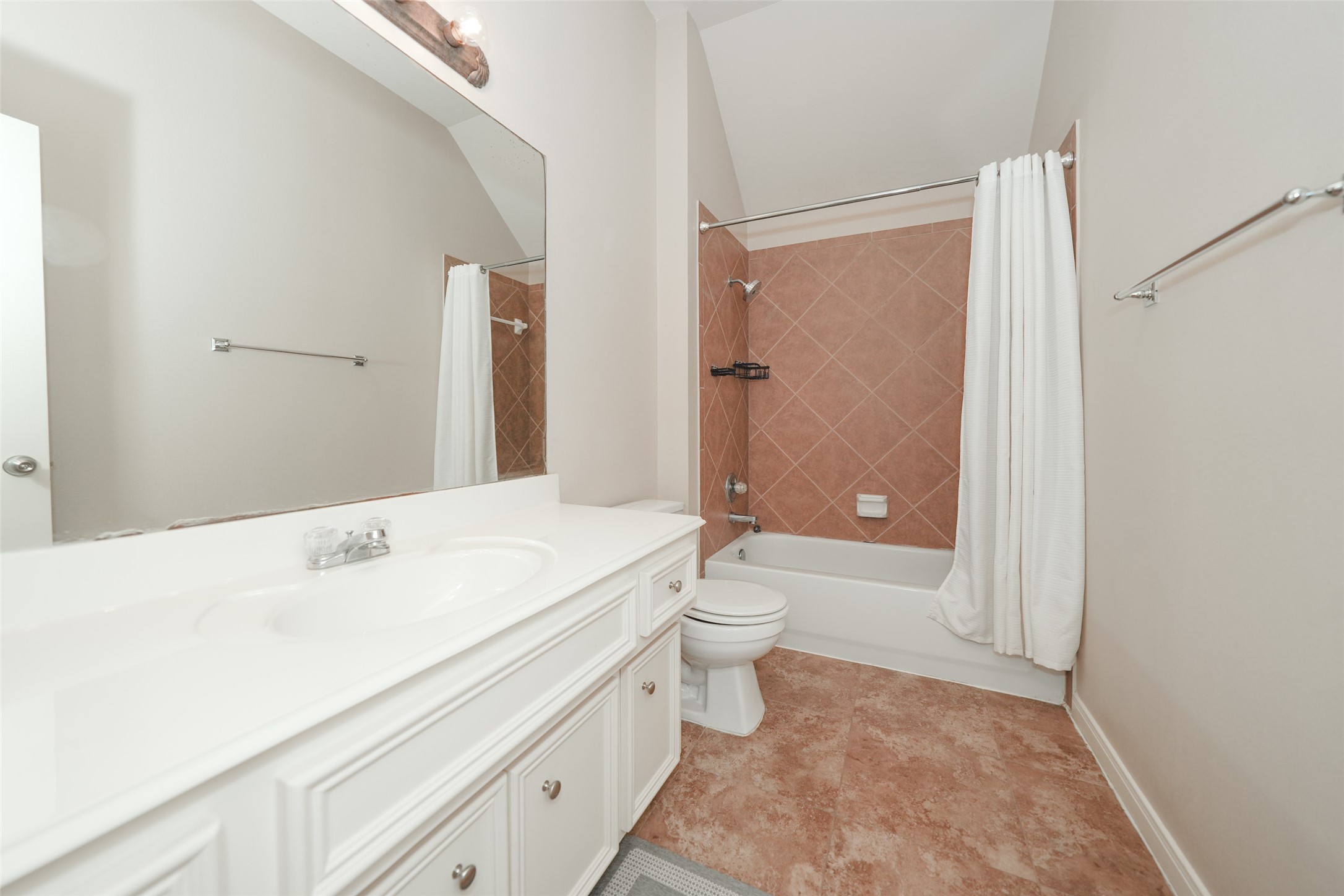 4415 Eden Point Lane Katy, TX 77494 - Photo 12 of 13 a bathroom with a sink a toilet and shower
