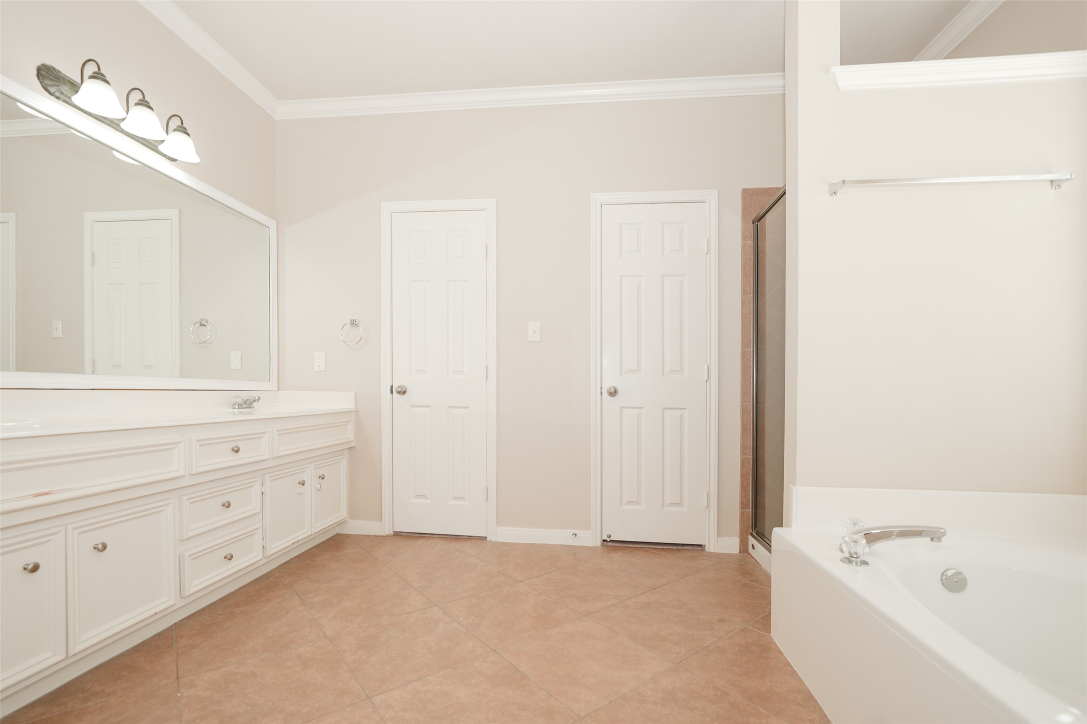 4415 Eden Point Lane Katy, TX 77494 - Photo 9 of 13 a bathroom with a tub sink and mirror