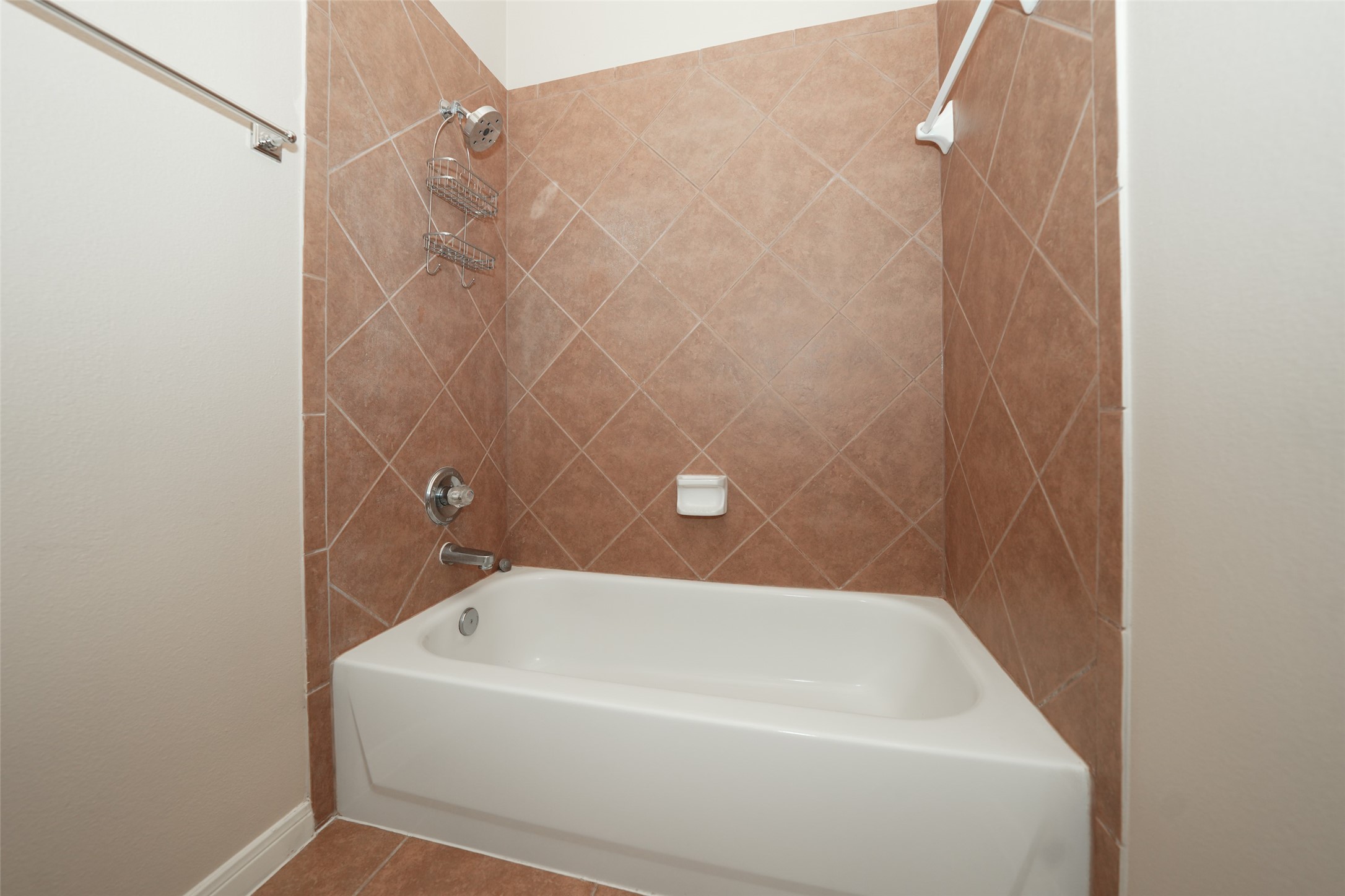 4415 Eden Point Lane Katy, TX 77494 - Photo 10 of 13 a bathroom with a white bath tub