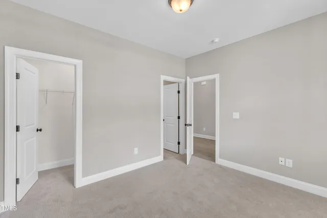 a view of an empty room with a fireplace