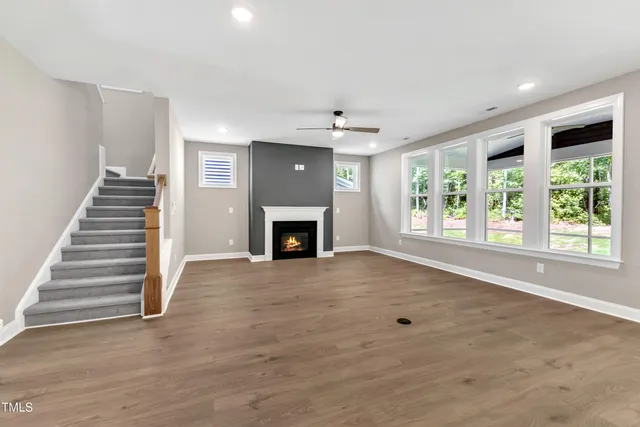 a large kitchen with kitchen island a sink a center island stainless steel appliances and a cabinets