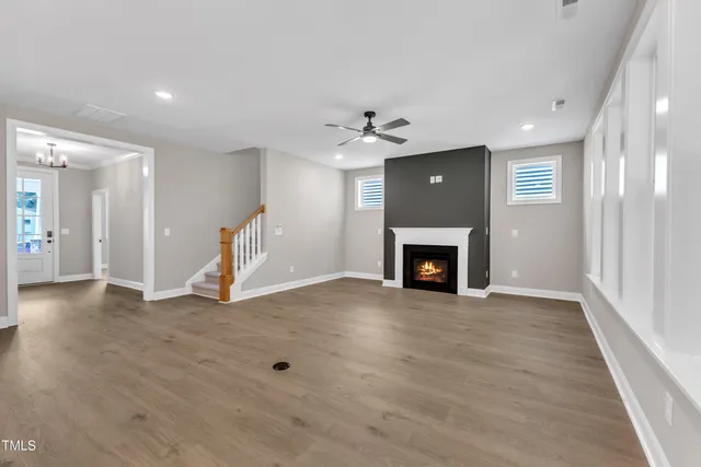 a kitchen with kitchen island granite countertop a sink a center island a counter space and cabinets