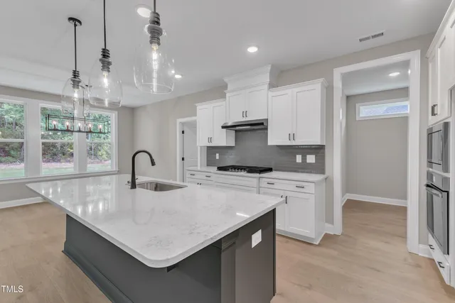 an empty room with closet and a bathroom