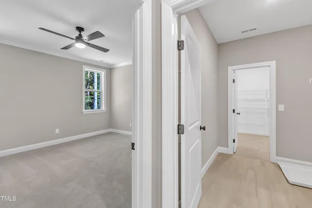 a view of a room with white walls