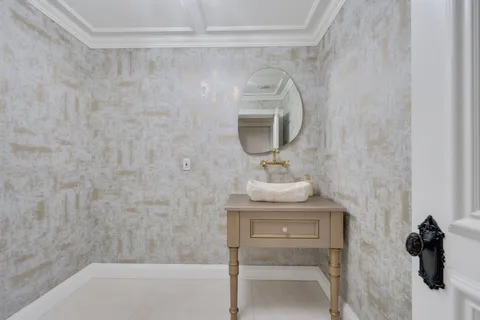a bathroom with a sink a vanity and mirror