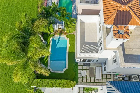 a view of a house with a palm tree
