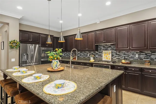 a kitchen with a table and chairs in it