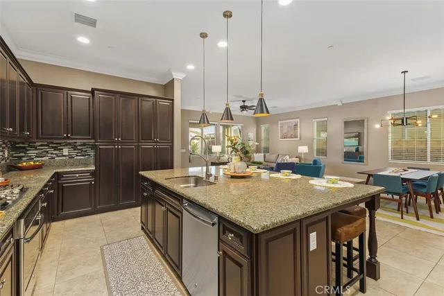 a living room with furniture and floor to ceiling windows
