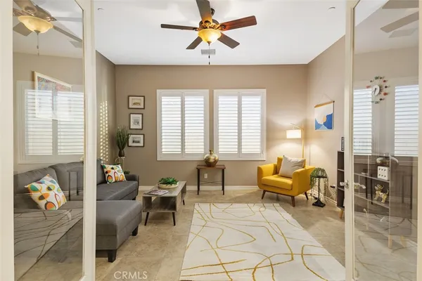 a living room with furniture and a window