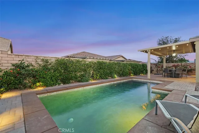 a view of a swimming pool with a patio