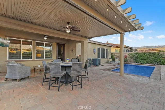 a view of house with yard outdoor seating and entertaining space