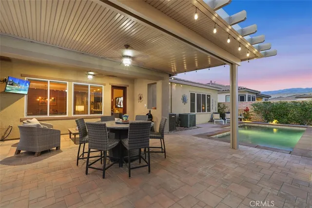 a outdoor space with patio the couches and a dining table with garden view