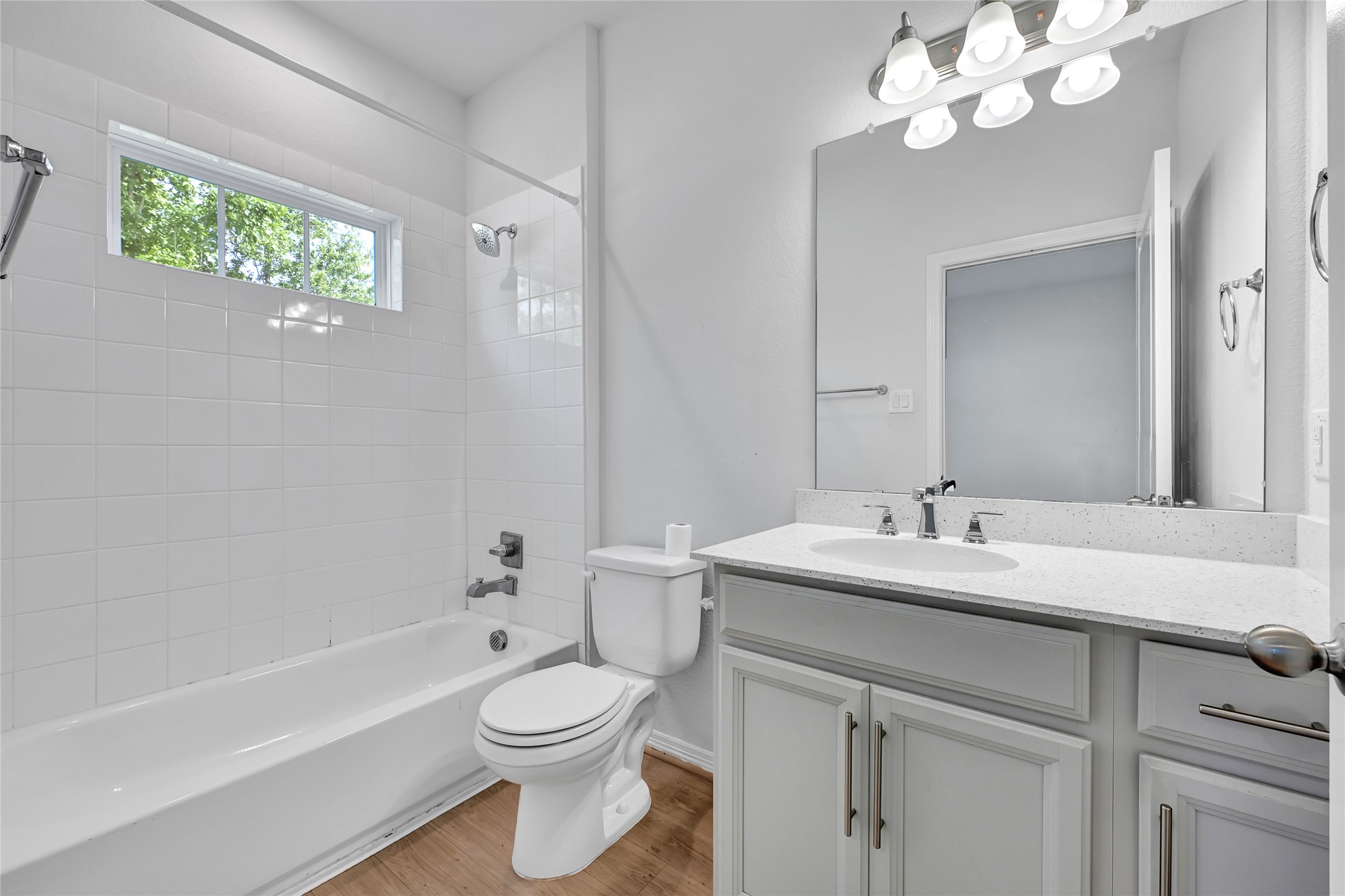 6320 Paris Street Houston, TX 77021 - Photo 12 of 16 a bathroom with a toilet a sink a mirror a bathtub and vanity