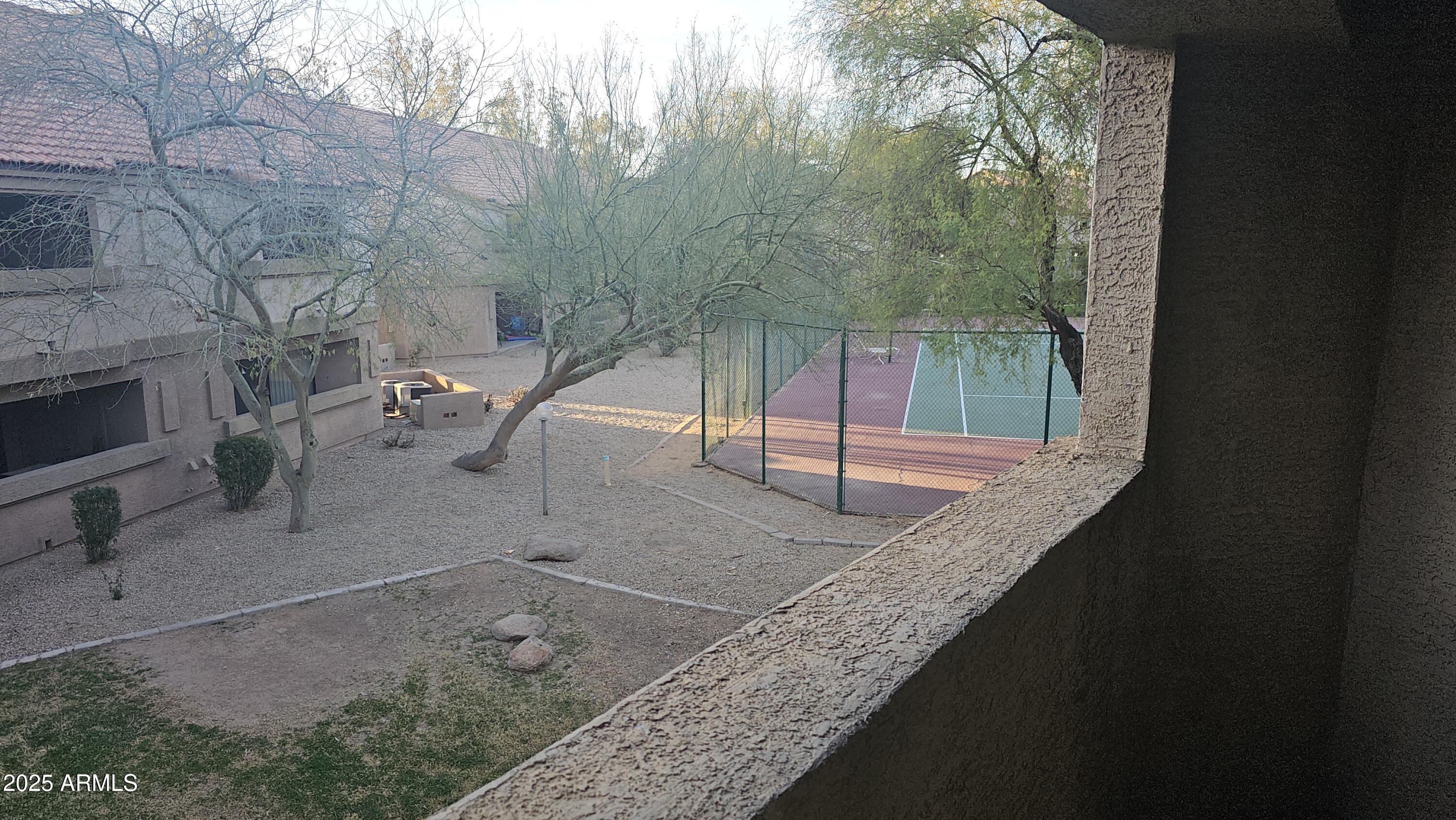 1287 North Alma School Road, Unit 262 Chandler, AZ 85224 - Photo 12 of 19 a backyard of a house with table and chairs