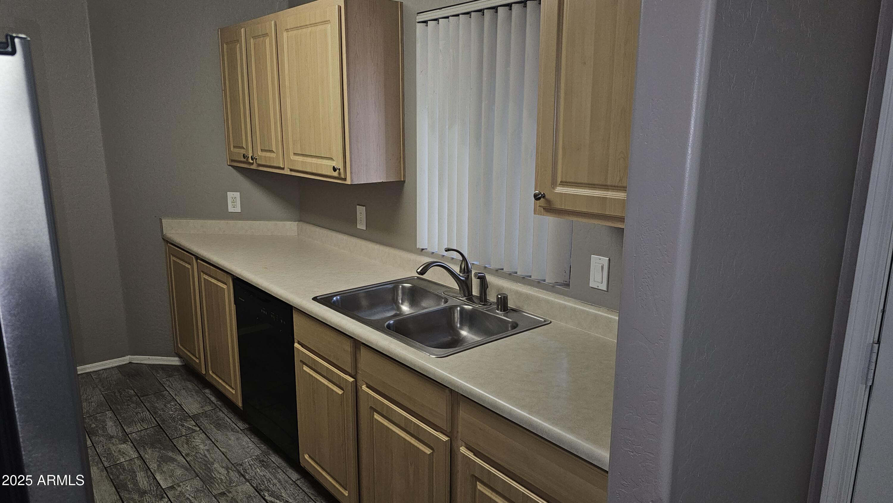 1287 North Alma School Road, Unit 262 Chandler, AZ 85224 - Photo 6 of 19 a kitchen with a sink and cabinets
