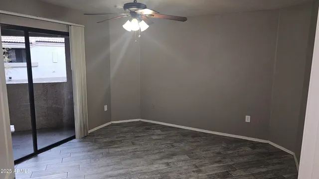 wooden floor in an empty room with a mirror