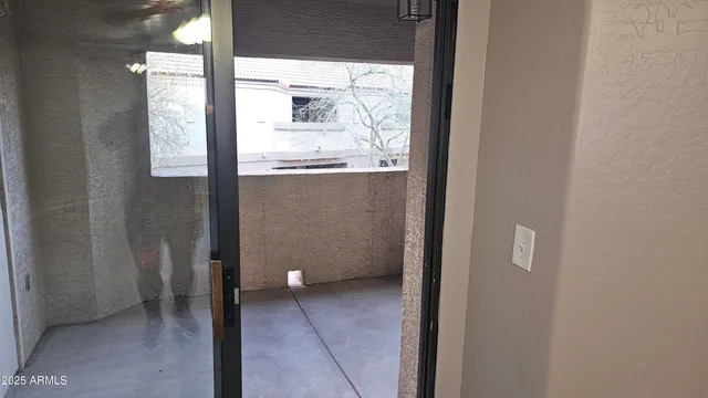 a view of a bathroom with a glass door