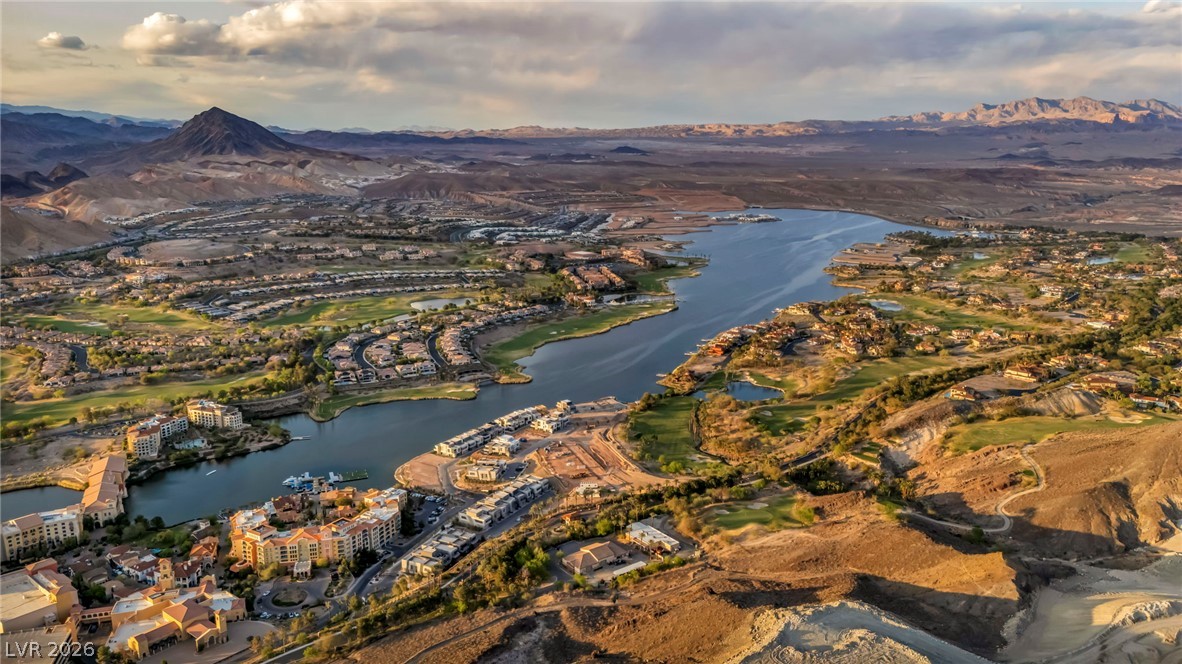 3 Rue Promenade Way Henderson, NV 89011 - Photo 14 of 26 Vast desert landscape frames a lakefront community with rolling golf courses and distant mountains.
