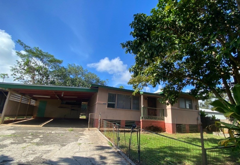 4406 Punee Road Koloa, HI 96756 - Photo 1 of 1 a view of house and yard with trees in the background