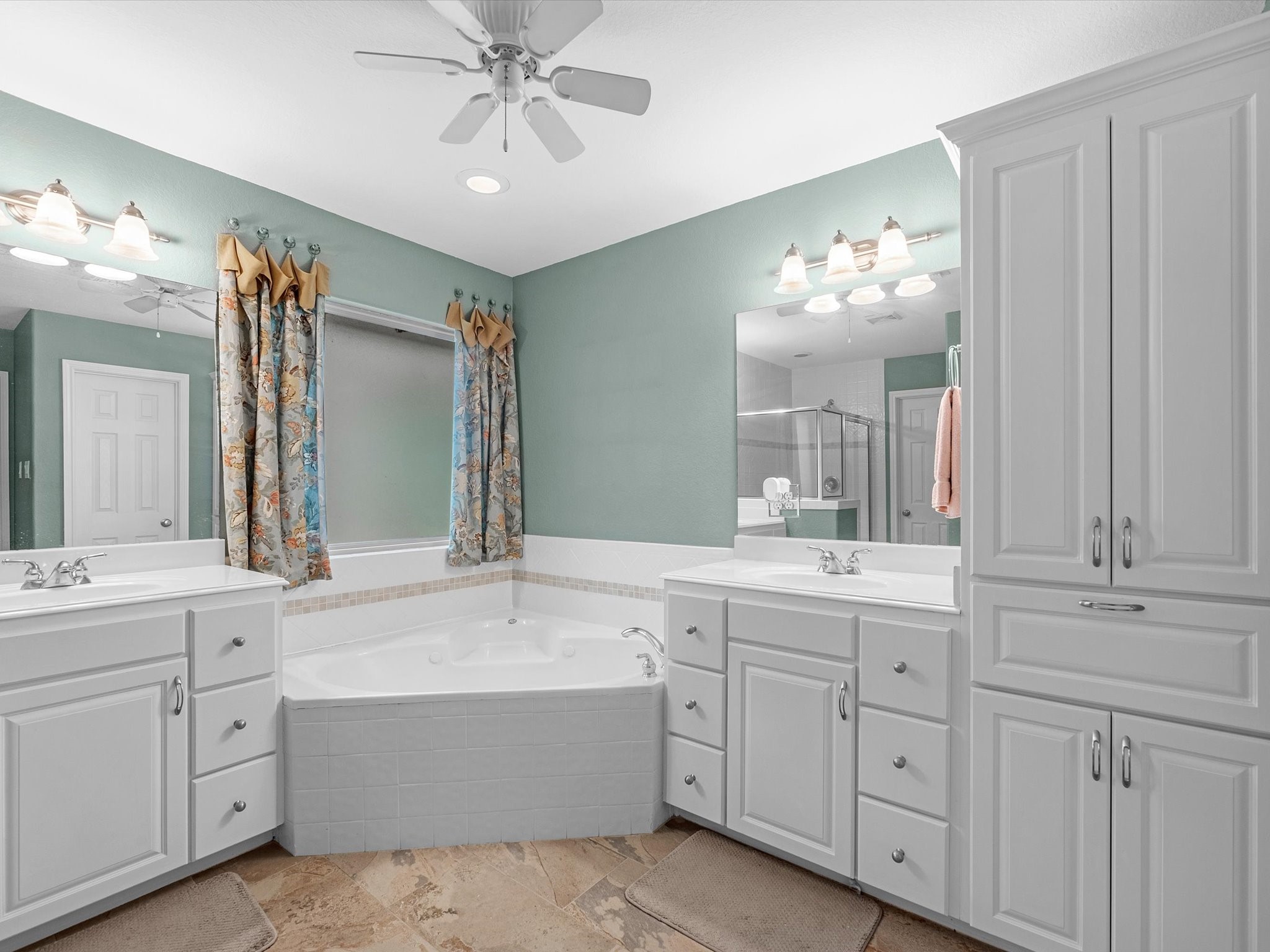 19019 Relay Road Humble, TX 77346 - Photo 22 of 31 a bathroom with a double vanity sink mirror and bathtub
