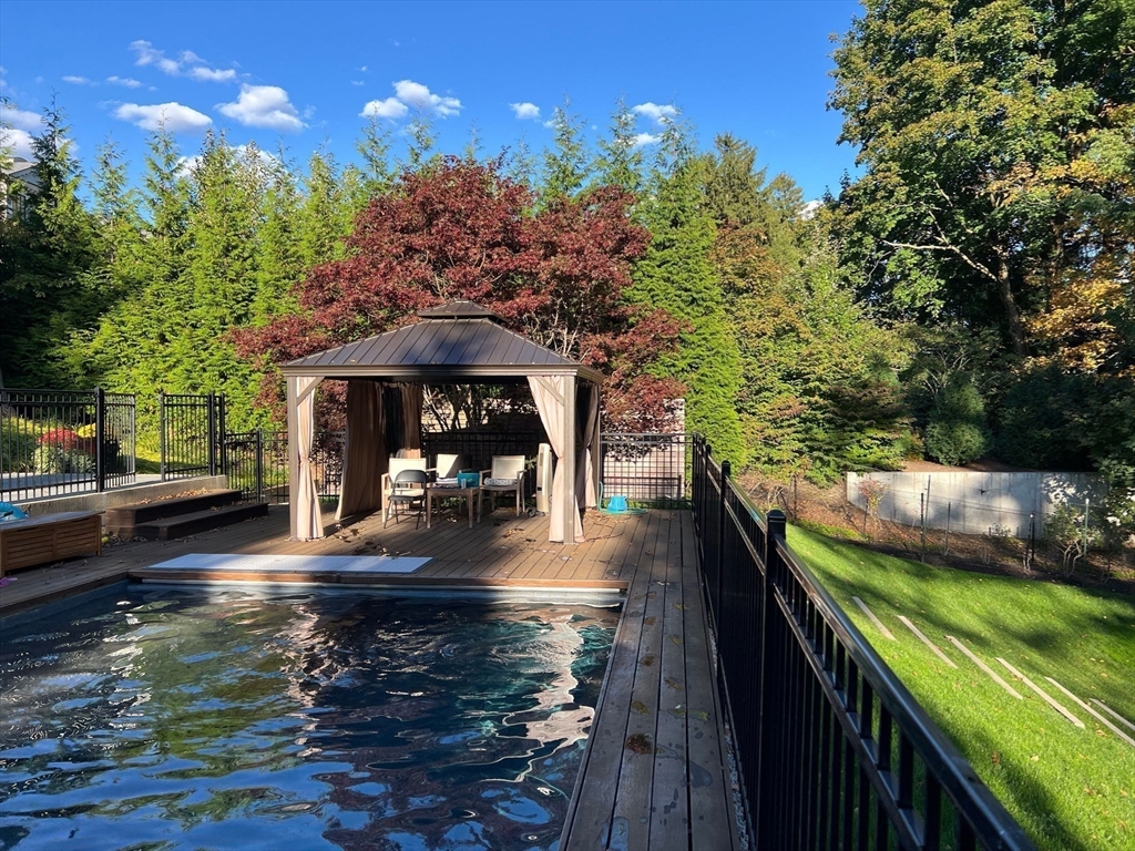 33 Leicester Street Brookline, MA 02445 - Photo 2 of 38 a view of a swimming pool with a patio