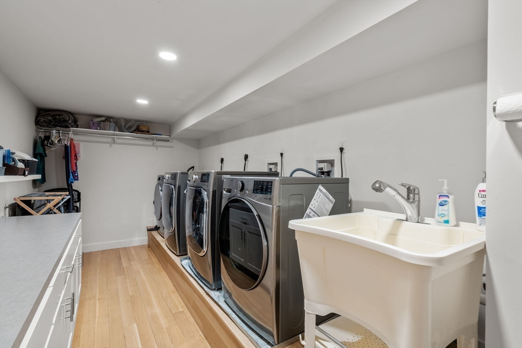 33 Leicester Street Brookline, MA 02445 - Photo 26 of 38 a utility room with sink dryer and washer
