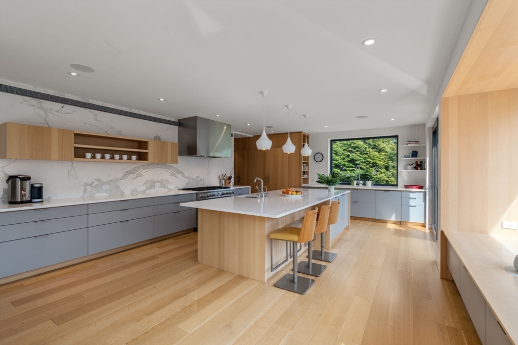 33 Leicester Street Brookline, MA 02445 - Photo 10 of 38 a kitchen with stainless steel appliances granite countertop a stove a sink and a refrigerator