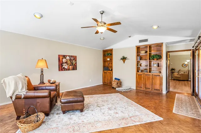 a living room with furniture and a rug