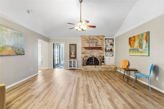 a view of a livingroom with furniture and a fireplace