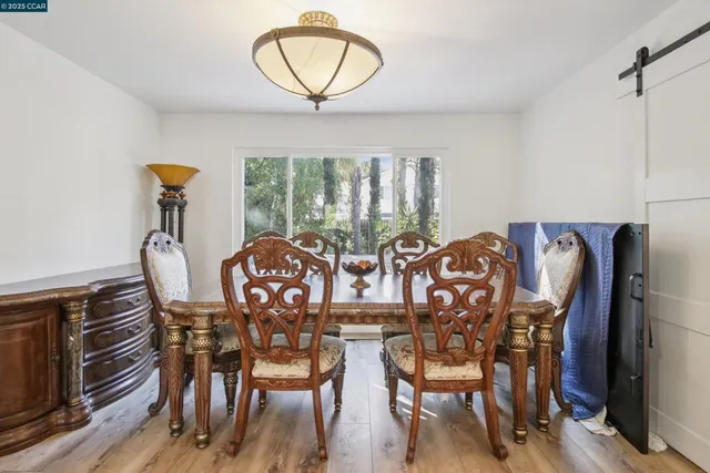 a view of a dining room with furniture window and outside view
