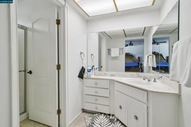 a bathroom with a sink double vanity and a mirror