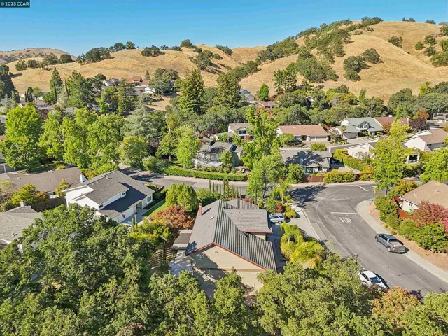 an aerial view of residential houses with outdoor space