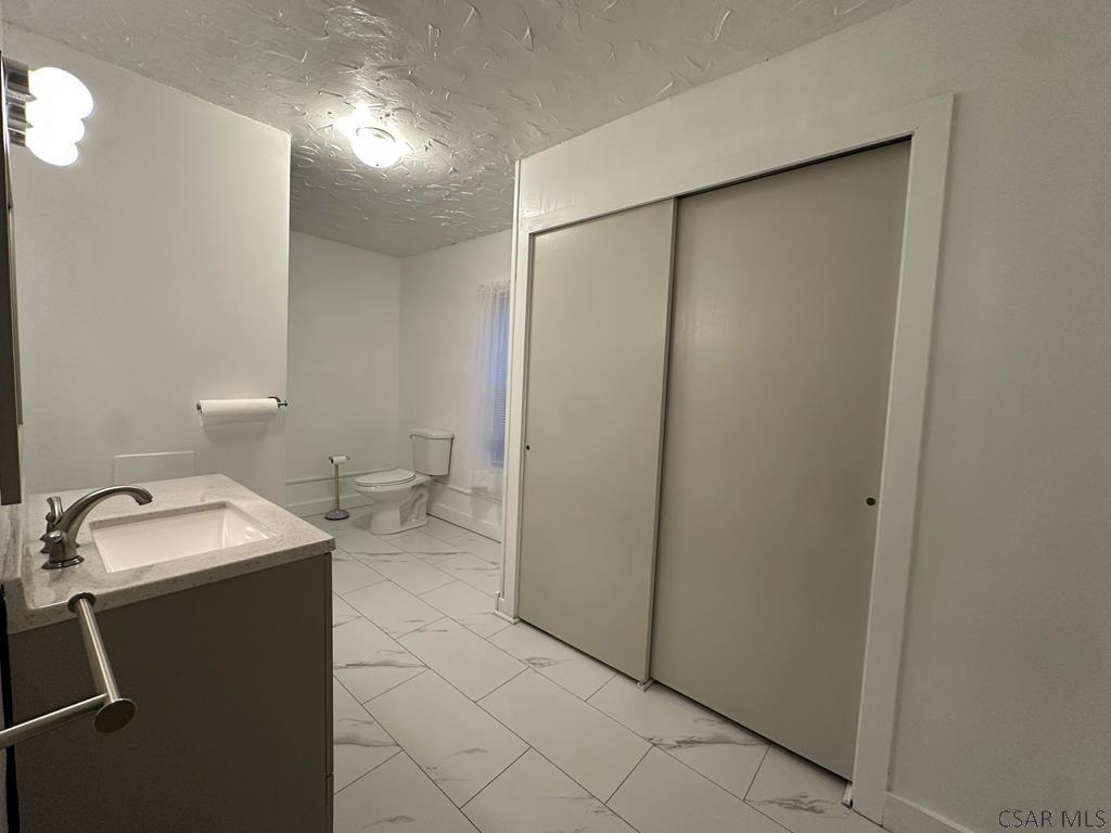 312 12th Street Windber, PA 15963 - Photo 10 of 24 a bathroom with a sink and a toilet