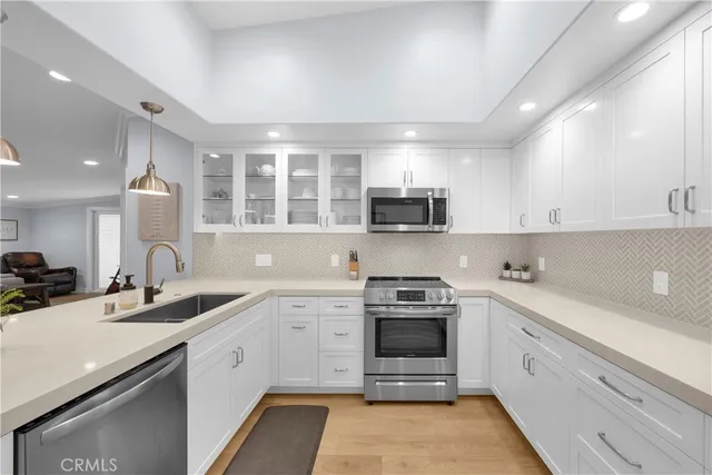 a kitchen with a stove and a microwave