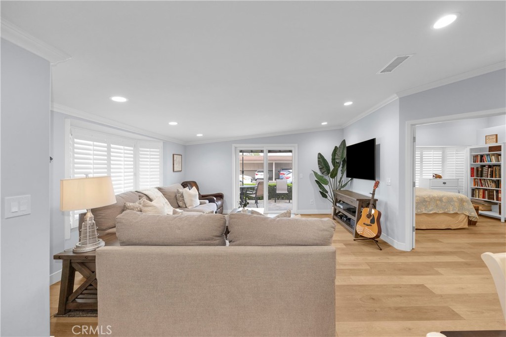 1671 Interlachen Road, Unit 285L Seal Beach, CA 90740 - Photo 8 of 51 Living room shade up to patio