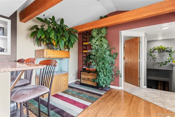 a bedroom with furniture and a gate