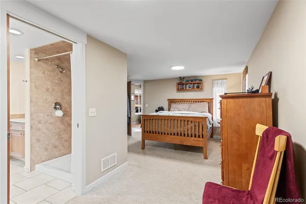 a bathroom with a granite countertop shower